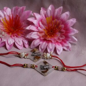 Transparent Resin Couple Rakhi - Image 3