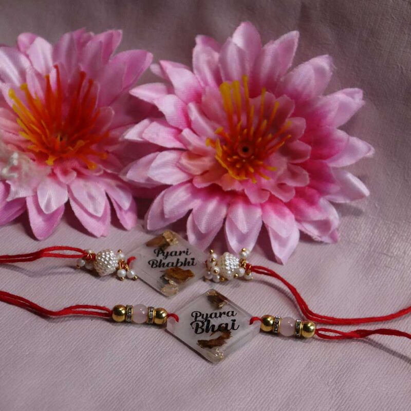 Transparent Resin Couple Rakhi - Image 3