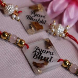 Transperent resin couple rakhi with Rose