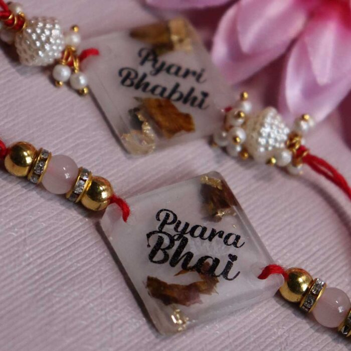 Transperent resin couple rakhi with Rose