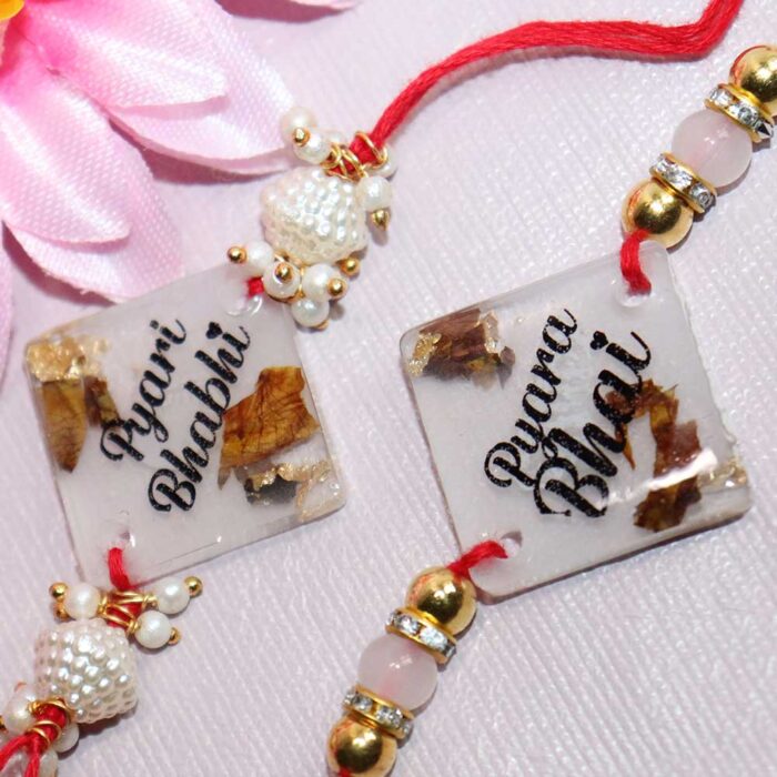Resin Transparent couple Rakhi with Rose Petals