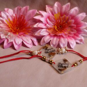 Transparent Resin Couple Rakhi - Image 2