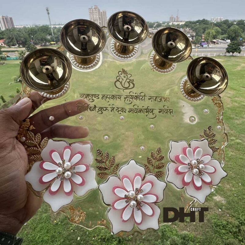 A royal themed Arati Plate white and pink flower and Shree Ganesh mantra