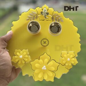 Yellow color Pooja thali with ganeshji idol andom sticker