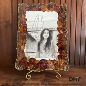 Varmala Photo Frame Made from Resin in display with DHT brand logo